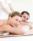 Attractive young couple receiving a back massage