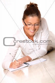 A young woman writing