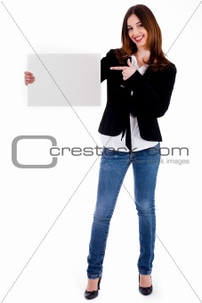 young lady pointing at blank board