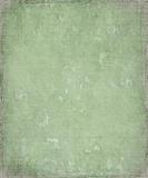 Faded grunge green plaster background with frame