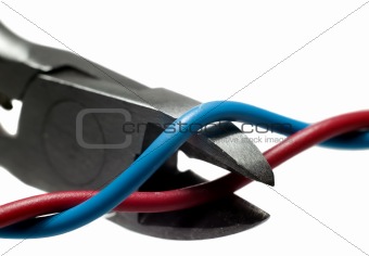 Metal nippers is cutting red wire