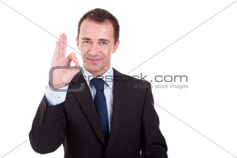 handsome businessman with thumb raised as a sign of sok, isolated on white background. studio shot