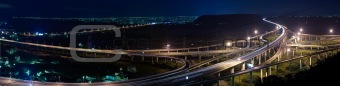Panoramic cityscape of freeway in night