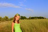 Teenage girl among the high grass