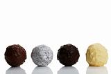 four different truffles in a row