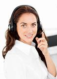Positive woman with headset working in a call center