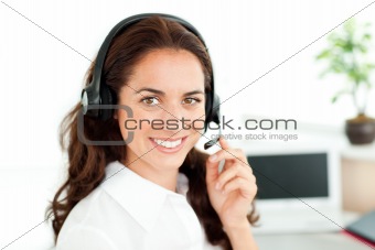 Smiling woman looking at the camera wearing a headset