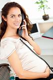 Charming pregnant businesswoman talking on phone