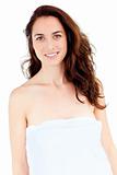 Cute caucasian woman with a towel on her body smiling