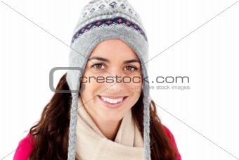 Happy woman wearing winter clothes smiling against