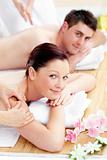 Happy caucasian couple receiving a back massage