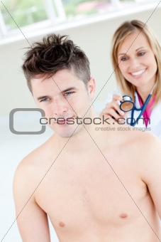 Smiling female doctor sounding her male patient