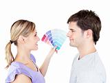 Bright couple choosing color for a room