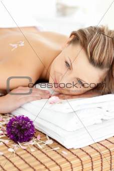 Portrait of a charming woman lying on a massage table