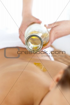 Close-up of a woman receiving a back treatment