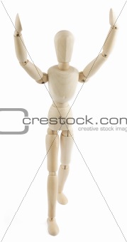 Wooden manequin raises his arms to the sky