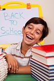 Smiling boy with school books