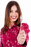 young woman showing toothbrush