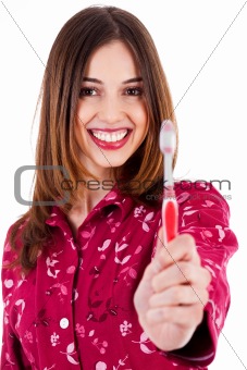 young woman showing toothbrush