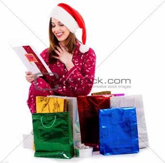 young lady with christmas card and gifts