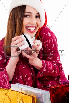 young woman posing with christmas gift
