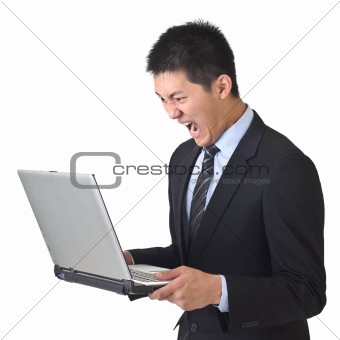 Angry business man holding laptop