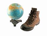 Brown boot next to a globe