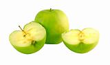 Green apple next to apples slices