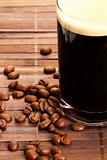 coffee beans near black coffee