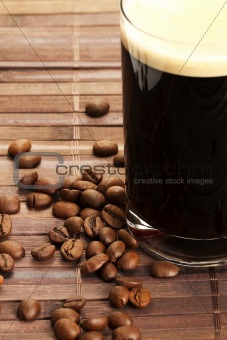 coffee beans near black coffee