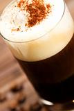 soft focus on milk froth of an espresso coffee with cocoa powder