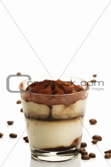 tiramisu in a glass with coffee beans