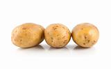 Three raw potatoes isolated on a white