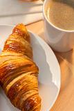 Continental Breakfast Croissant and Cup Of Coffee