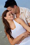 Man and Woman Couple In Romantic Embrace On A Beach