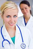 Two Attractive Smiling Women Doctors With Stethoscope
