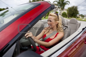 Beautiful Young Woman Driving Convertible Car Wearing Sunglasses