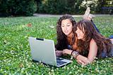 Two Young Woman With Laptop PC at Park