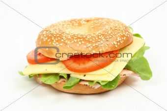 Fresh bagel sandwich over white background