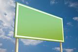 Green sign in front of a blue sky