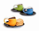 Three coffee cups with cookies