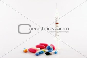 Medical syringe and pills