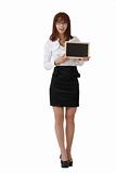 Smiling business woman holding blank blackboard