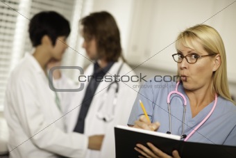 Alarmed Medical Woman Witnesses Her Colleagues Inner Office Romance Display.