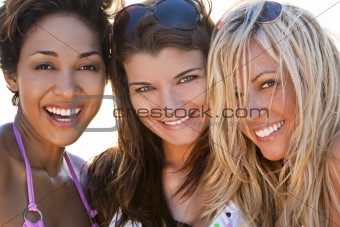Three Beautiful Young Women Friends Laughing At The Beach