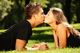 Young nice couple kissing in the park