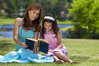 Woman and Girl, Mother and Daughter, Reading a Book Together Out