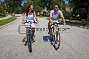 Romantic Man and Woman Couple Cycling Together