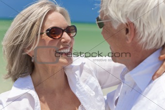 Happy Senior Couple Dancing Holding Hands on A Tropical Beach
