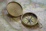 brass compas over South America map